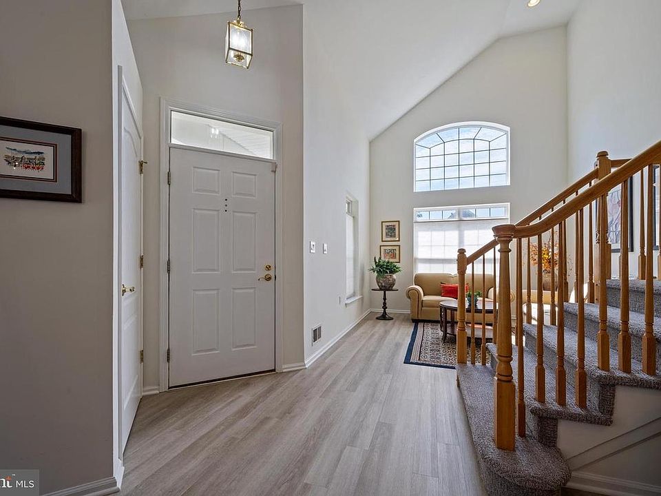 Living Room with stairs leading up to the 2nd floor.
