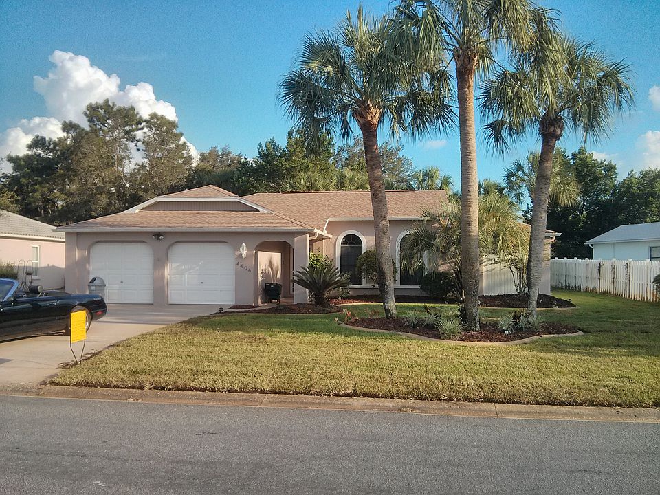 Fresh sod, plantings and curbed flower beds