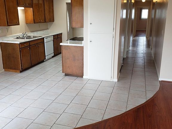 Kitchen with hallway to bedrooms and bathroms