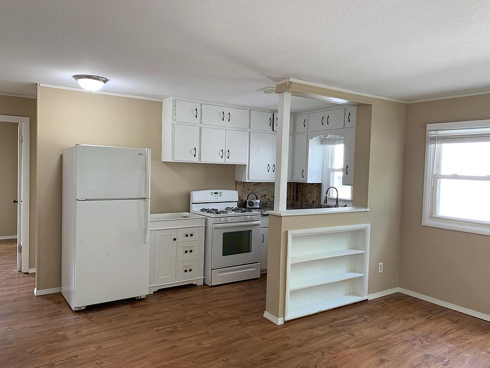 Kitchen has all-new cabinets and a gas stove (photo was taken before backsplash install--see other photos for kitchen with backsplash)