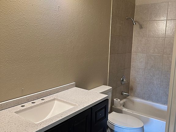 Bathroom still needs mirror and faucet installed. New vanity, counter and light.