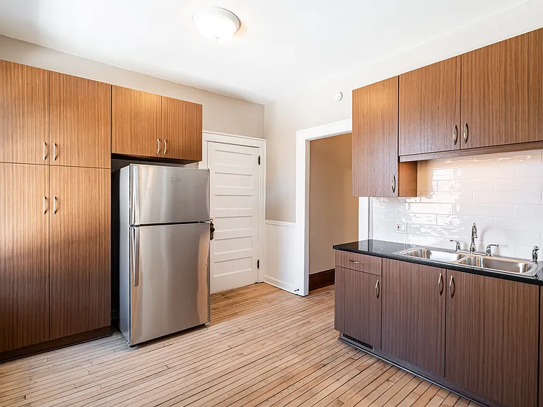 kitchen - rear stairway door is to right of fridge