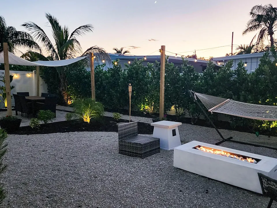 Enjoy your private, back yard with fire pit, hammock and dining area.