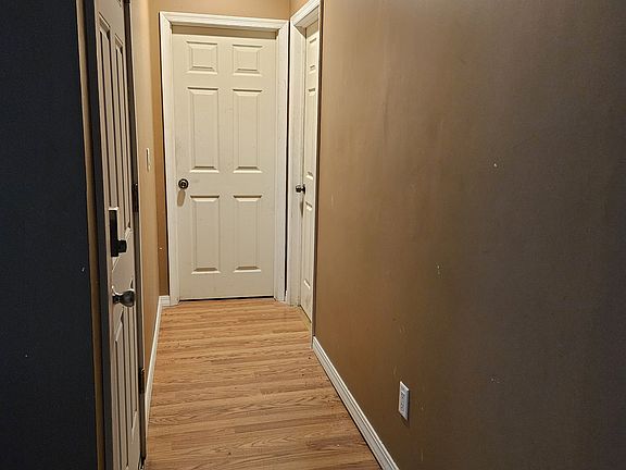 hallway where the 2 other bedrooms are