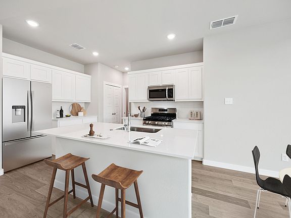 Kitchen in the Mesquite home plan by Trophy Signature Homes - REPRESENTATIVE PHOTO