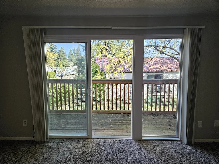sliding glass door to spacious deck