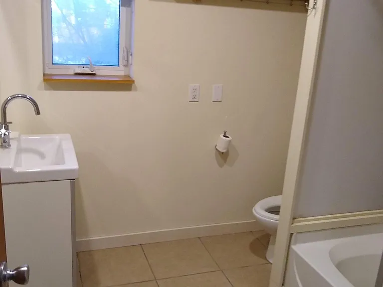 First floor bathroom w/shelves.