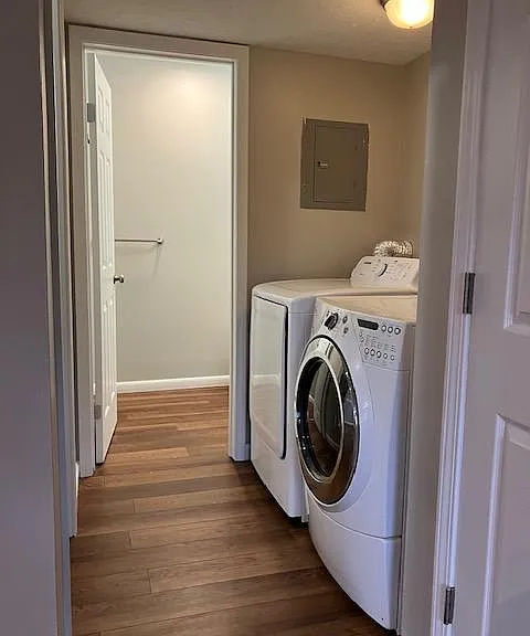 Laundry area and door to half bath.
