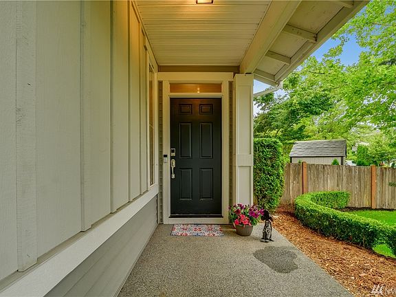 Covered front porch welcomes you and your guests into this gorgeous home. 