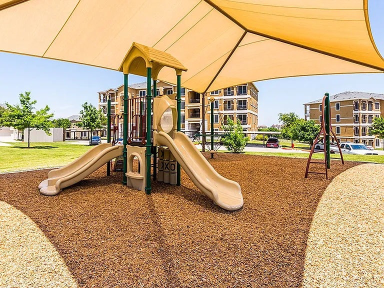 Our youngest residents enjoy an on-site playground with shade sail