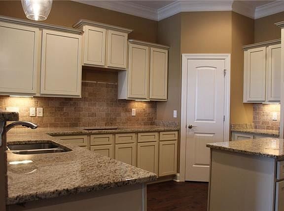 Stock photo showing this U shaped kitchen with working island
