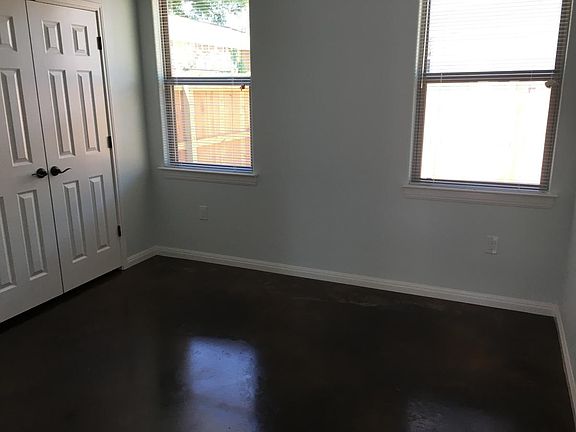Downstairs bedroom; stained concrete
