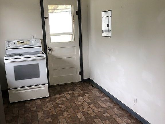 Kitchen leading to backyard