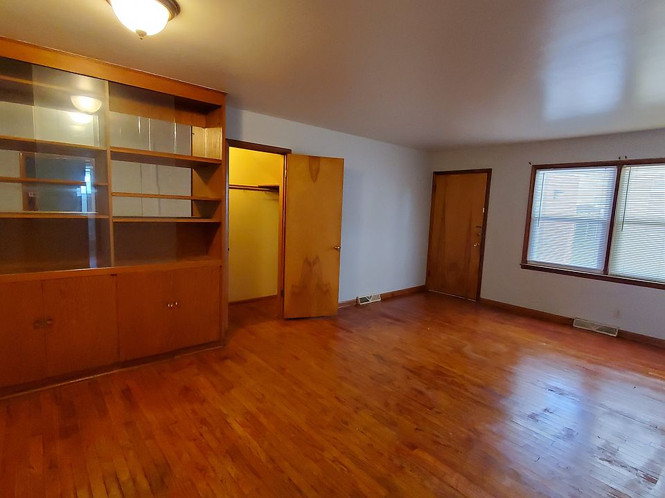 Living Room - View of the Built-In Storage, the Storage Closet and the Front Entrance