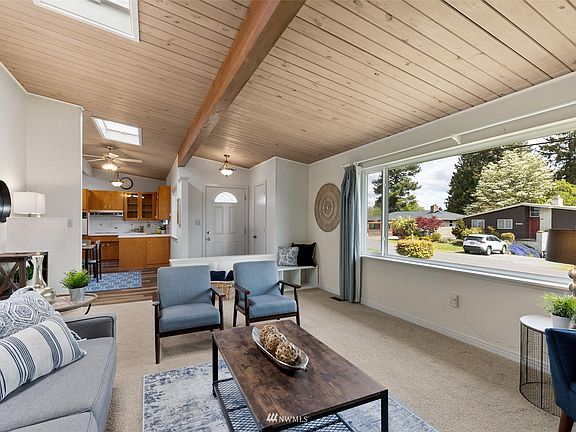 From the large picture window to the skylights- this family room is flooded with an abundance of light. 