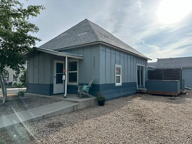 front photo, 2 off street parking spaces, deck off kitchen