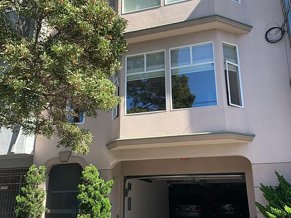 Front of condo building. unit is 2nd floor above garage