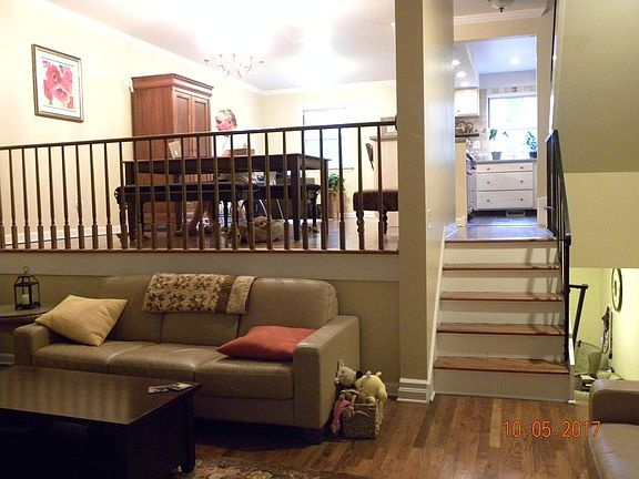 Living room lower level, dining area and kitchen upper level