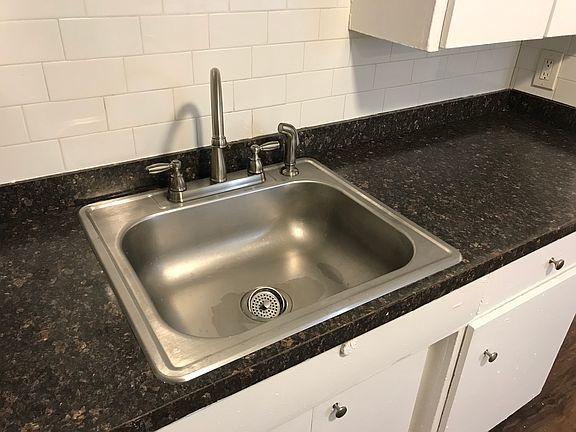 Upgraded faucet and new tile backsplash