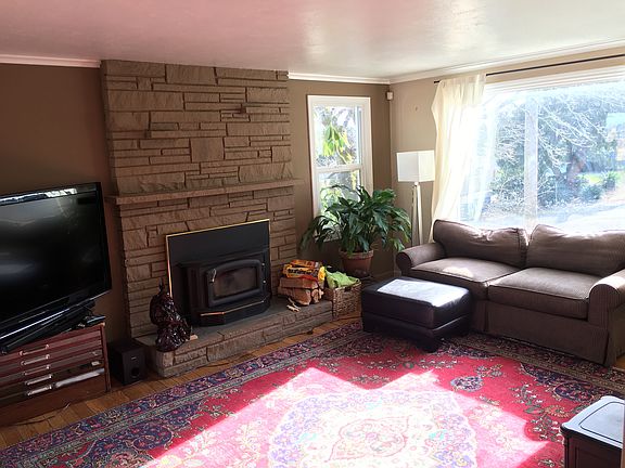 Living room w/ wood burning stove