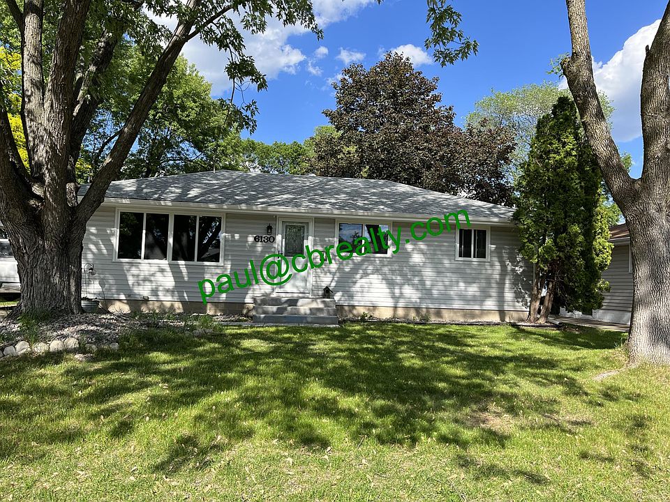 Nicely updated rambler on wooded lot, new roof & windows.