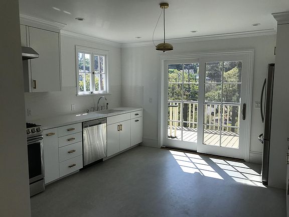 Kitchen with space for eat in table and deck off of the kitchen.