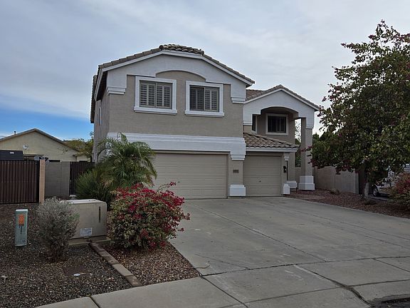 Outside of home. 3 car garage and mature landscaping.