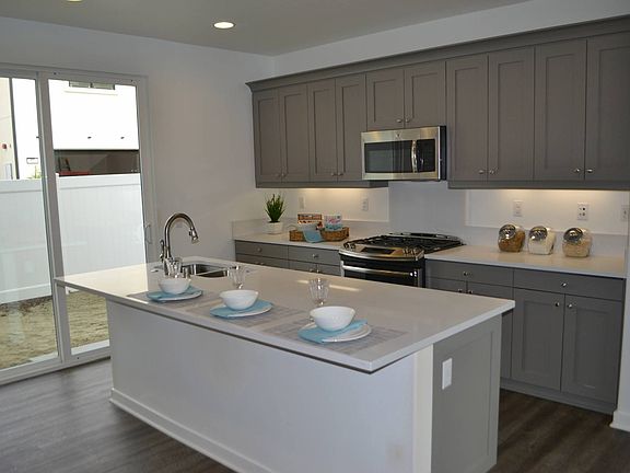 ElevationHomesite 18 has striking grey kitchen cabinets.