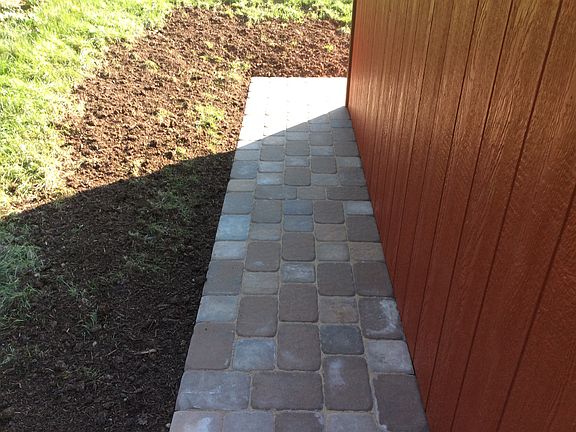 Pavers around shed perimete.