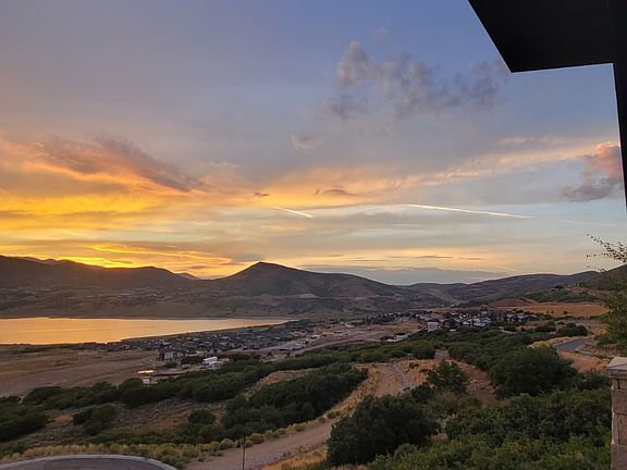 Sunset view from Main floor Deck Sept, 2025. North view of Lake Jordanelle, PCMR & Canyons Ski Resorts.