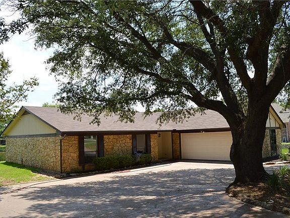 CIRCLE DRIVE ALLOWING VEHICLES MORE ROOM FOR PARKING OR DRIVING OUT. THE OAK PROVIDES GREAT SHADE.