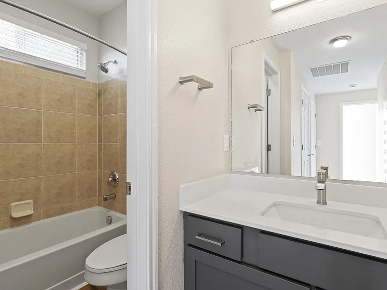 Brightly lit bathroom at Switchback on Platte Apartments in Littleton, CO