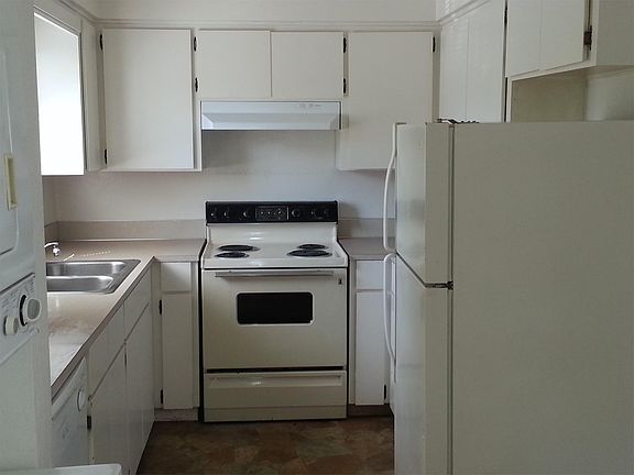 Kitchen...stove, oven, fridge, dishwasher, and garbage dispo