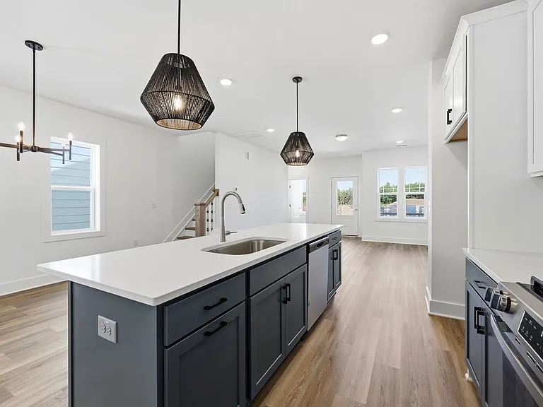 kitchen with dishwasher, oven, microwave, and refrigerator