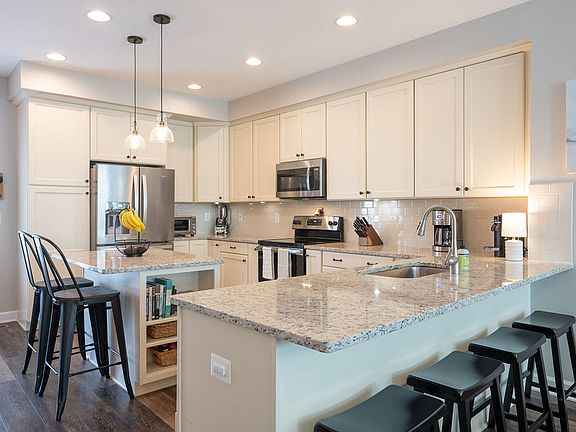 Kitchen: Granite, Maple cabinets, Island, Breakfast bar, Dishwasher, Disposal, Eat-In, Recessed-lights, Refrigerator, Electric range, Microwave, Pantry.
