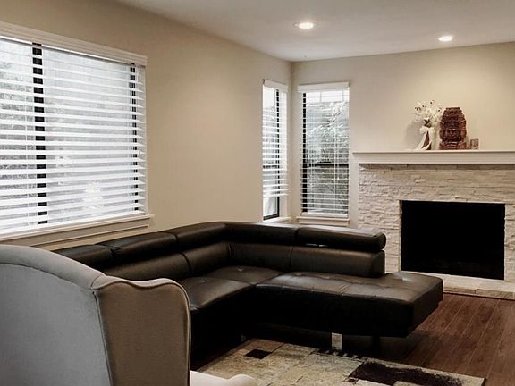 Spacious living area with tons of windows and natural light!
