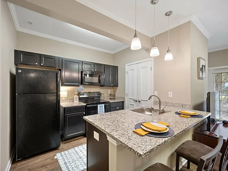 Cook in Style with Granite Countertops and Modern Appliances at Eagle Flatts Apartments in Hattiesburg