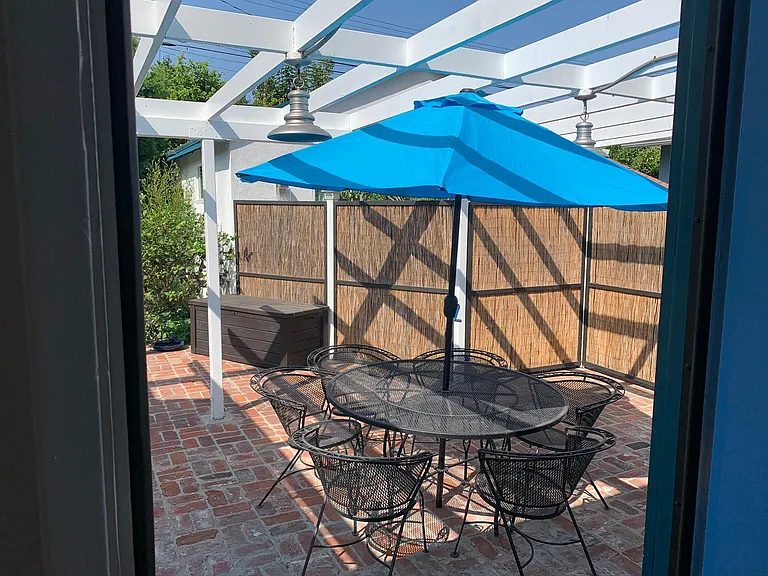 Patio table, chairs and umbrella included with rental.