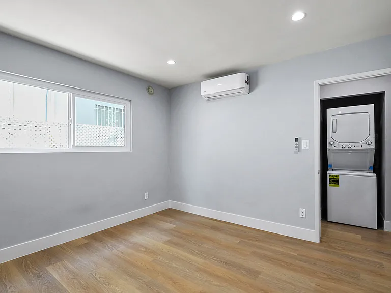 Bedroom with Recessed Lighting, Vinyl Flooring, and Windows