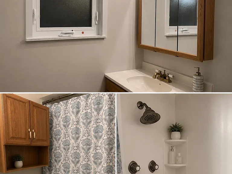 Full bathroom with updated vanity, mirrored medicine cabinet, and tub/shower combo featuring built-in corner shelving.