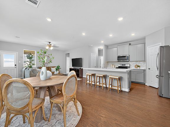 Kitchen & Dining The open-concept kitchen and dining area is perfect for hosting family dinners or casual gatherings, with stylish finishes and great natural light.