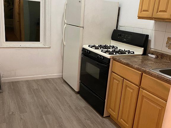 Kitchen with brand new plank flooring.