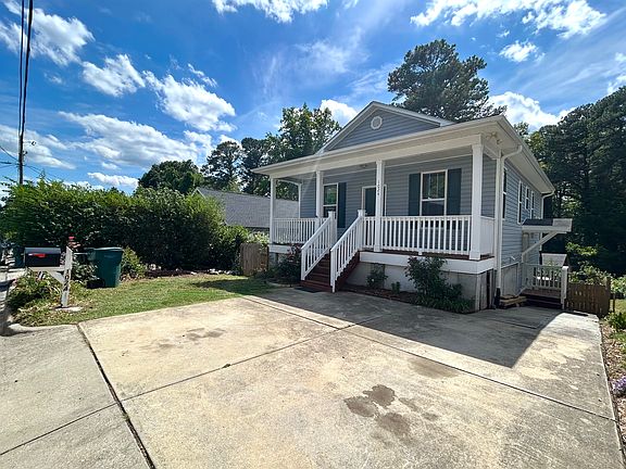 You can choose from 4 parking spots: 3 in the private driveway and one dedicated street spot out front. Flower beds line the driveway, keeping the entrance looking clean and welcoming year-round.