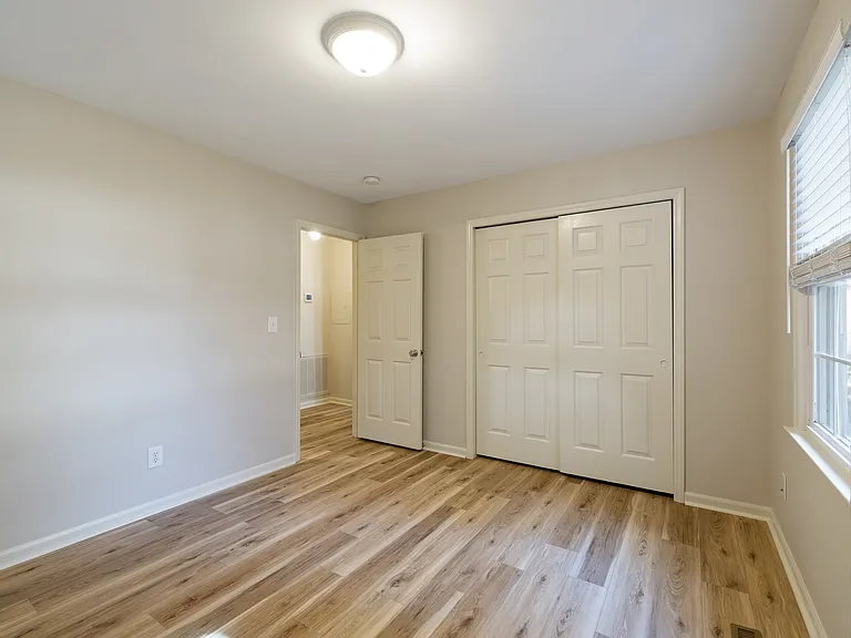 Bedroom 1; front corner of home; looking at door to hall and closet
