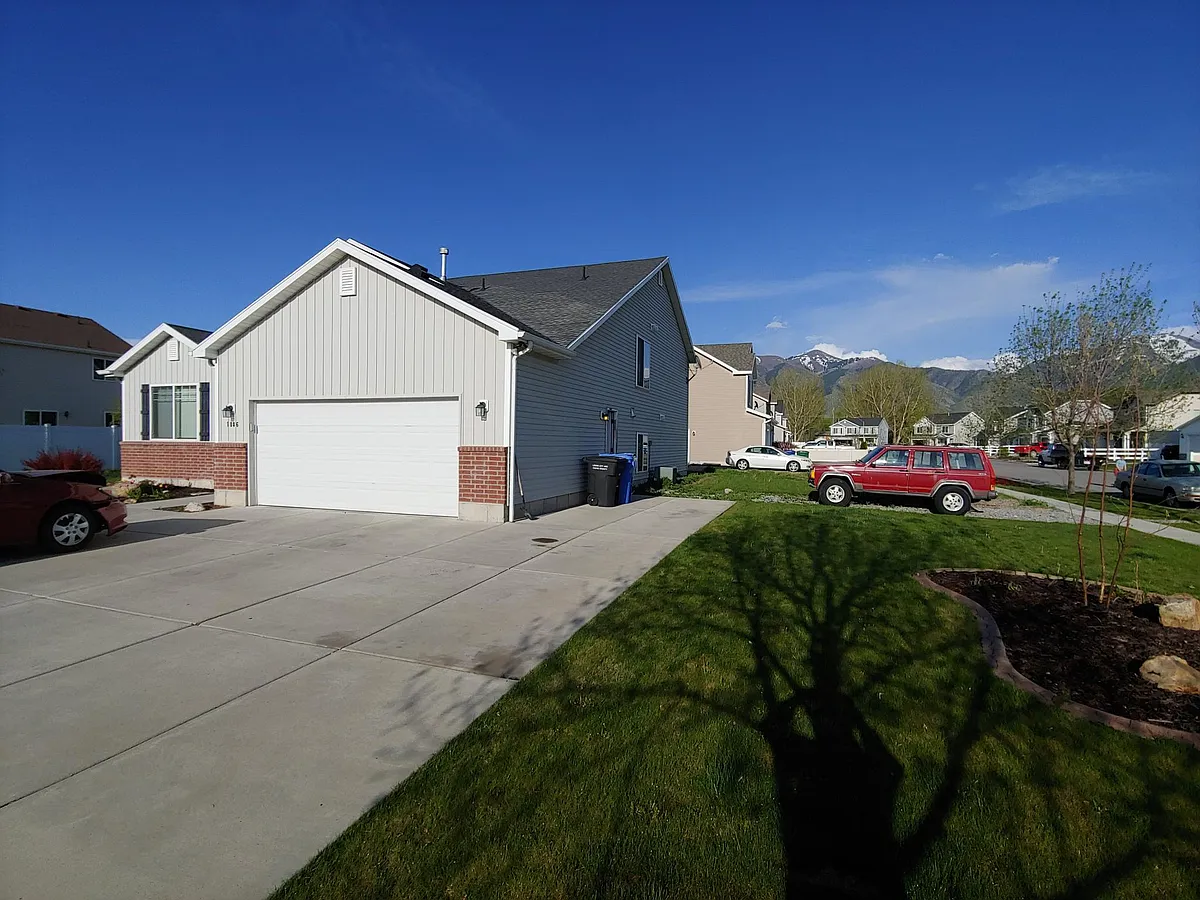 Right side with lots of extra parking. - 1086 S 830 W