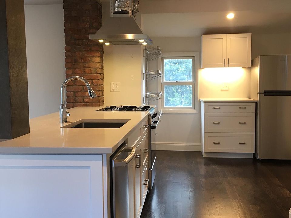 Newly designed kitchen with all wood cabinets and quartz countertops