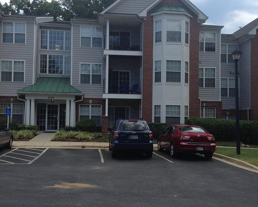 Font of building/Condo to right of front door