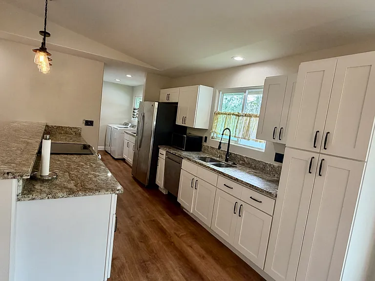 Laundry room off the kitchen leading to carport