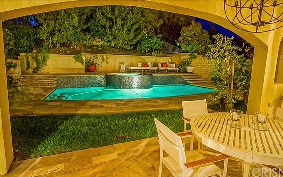 Versailles Travertine flooring around pool decking