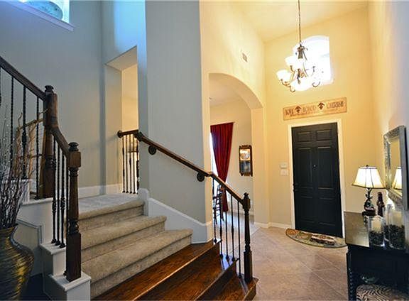 Two story entry welcomes you into the home....appealing iron balusters and wood entry stairs lead you upstairs